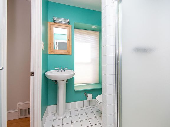 3rd floor bathroom 

Connects to Primary bedroom and wraps around to additional bedroom/office/closet room - doors on both entrances.
