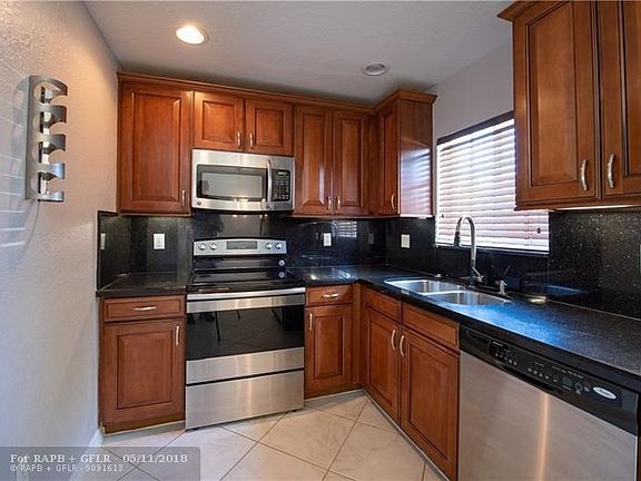 Granite Counters and wood cabinets.