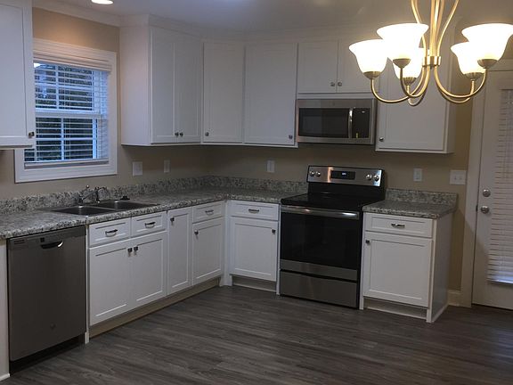 Beautiful kitchen with microwave, dishwasher, self cleaning oven, & disposal. Refrigerator NOT furnished. Eat in dining area, kitchen, living room with open concept.