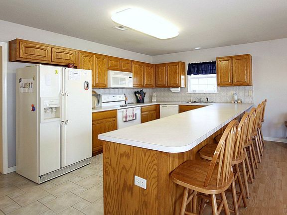 Large kitchen overlooking 2nd living area and dining.  Breakfast bar seats 6.