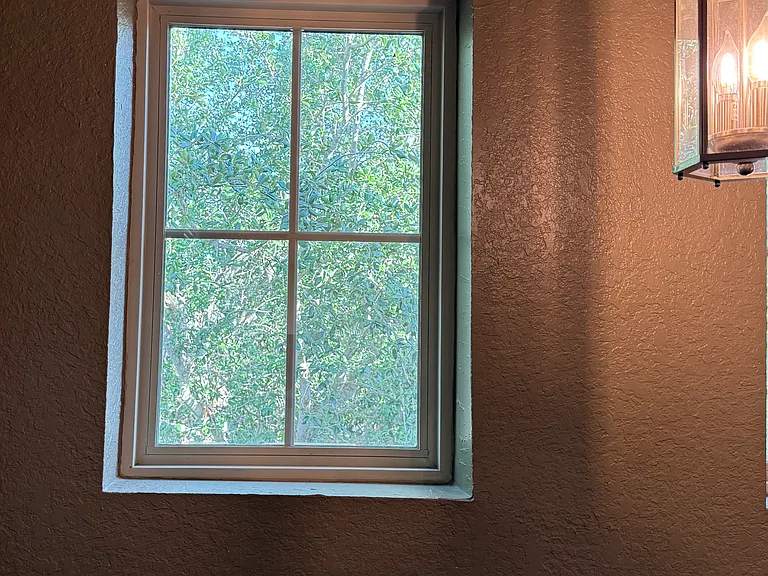 Enjoy views of Oak trees and their leaves through the upstairs windows as you walk the sky walk to the three colorful bedrooms
