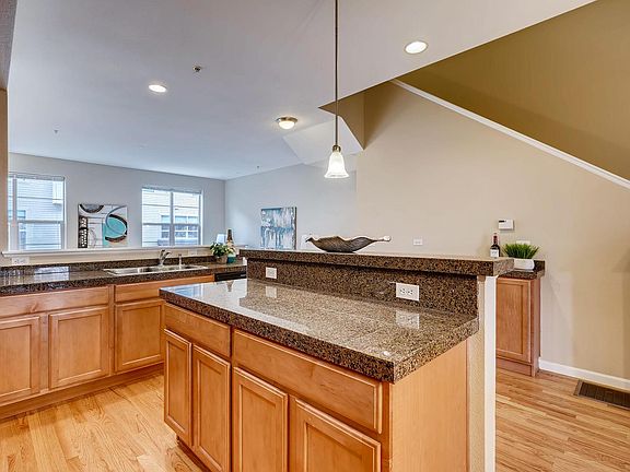 Granite counter tops and refinished hardwood floors.