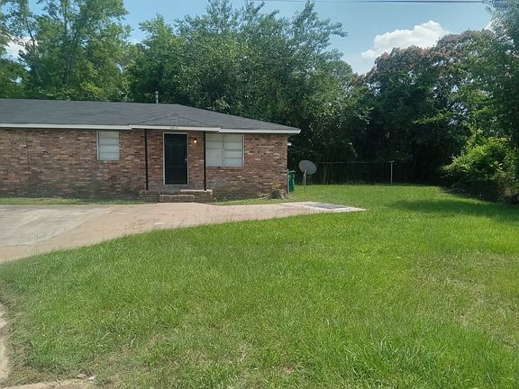 Front of the house with parking and side view