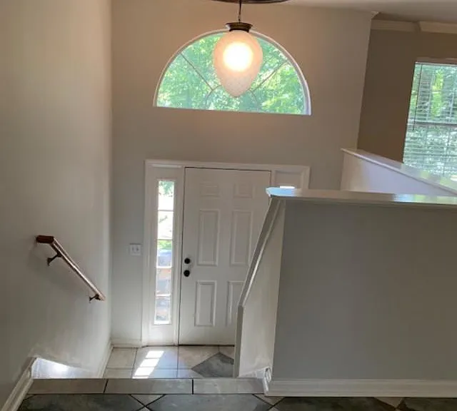 view of foyer and front door from family room