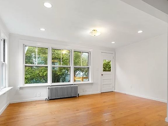 The family room off the kitchen is large and sunny and faces the garden.
