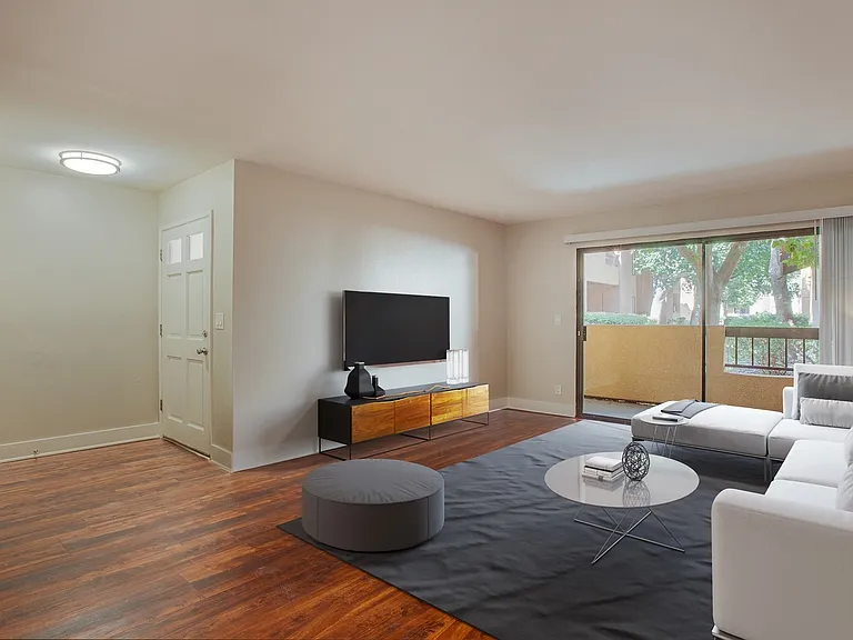 Spacious living room with wood flooring throughout