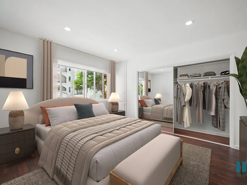 Bedroom with a Mirrored Closet and Natural Light