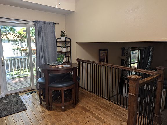 Main Level:
Open-concept sitting and dining area located just off the kitchen. This bright, versatile space is adjacent to a sliding glass door that opens onto the deck_perfect for indoor-outdoor meals or enjoying natural light throughout the day.