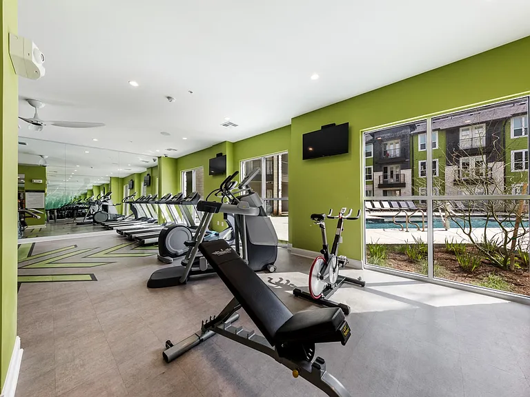 Cardio machine area overlooking the interior pool courtyard
