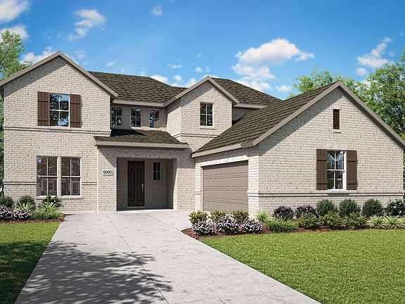 A two-story brick house with a well-manicured lawn and landscaping, set against a backdrop of blue s