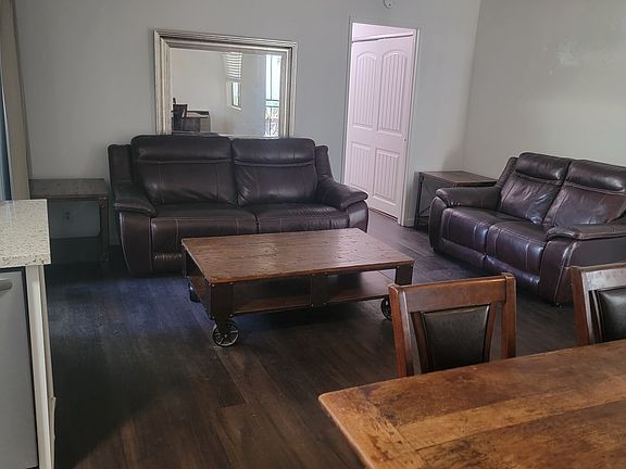 Open floor plan kitchen, dining, and living room (dining table optional and can remain upon request).