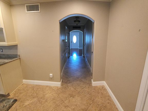 From back of house, view of front door