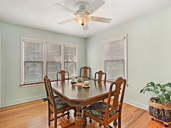 The pretty hardwood floor is exposed in the dining room where everyone can gather for food and conve