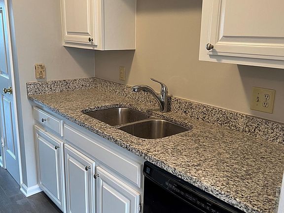 Galley style kitchen with all appliances and granite counter tops