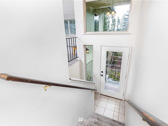Entry way, Main living area on upper level including all bedrooms, garage, utilities and rec room on lower level. 