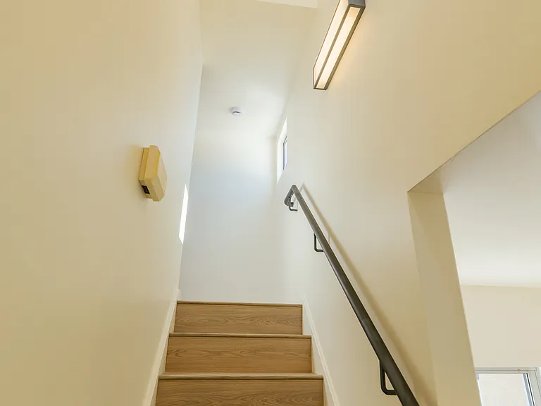 Looking up the stairs from the first floor right off the kitchen.