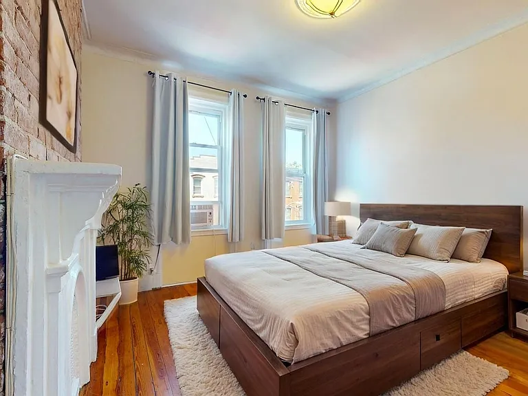 Bedroom 1 (virtually staged to show you multiple furniture layout options)