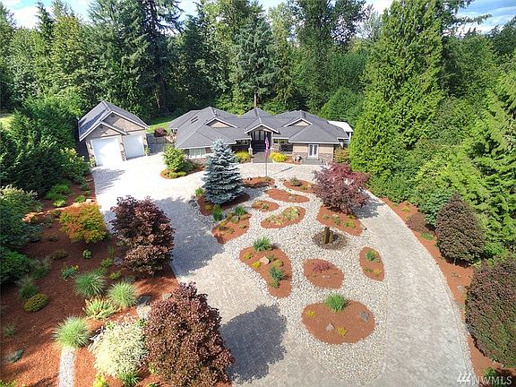 Detached garage/shop features large bay doors for indoor RV parking & ¾ bath. The property has been expertly landscaped and beautifully maintained. Fully fenced back yard with sprinkler system backing to a gorgeous green belt. The Grove is an exclusive neighborhood of luxury homes, situated in close proximity to freeways, SeaTac Airport, hospital, major retail, dining and business hubs. Sought after, award winning Tahoma Schools.