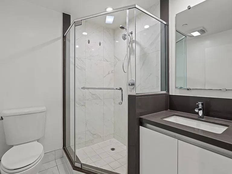 Bathroom with Walk-In Shower & Glass Door, and Vanity Cabinet Storage