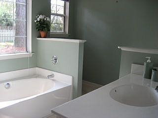 Master bath has soaking tub, standup shower and dual sinks.