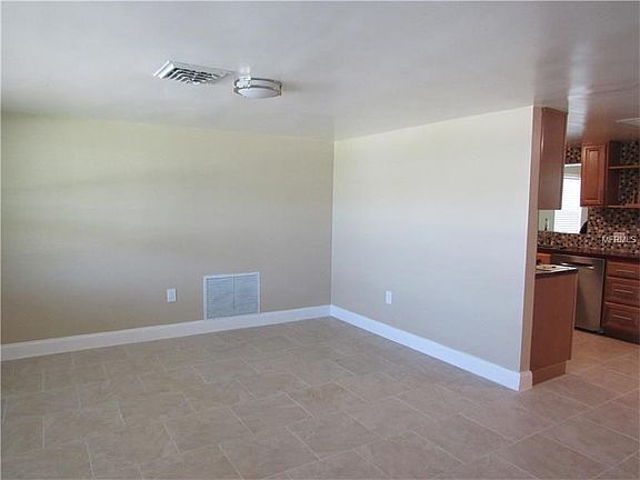 LIVING ROOM WITH NEW PAINT & TILE
