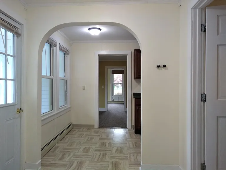 From entrance towards kitchen eat-in area to living room and bedroom beyond