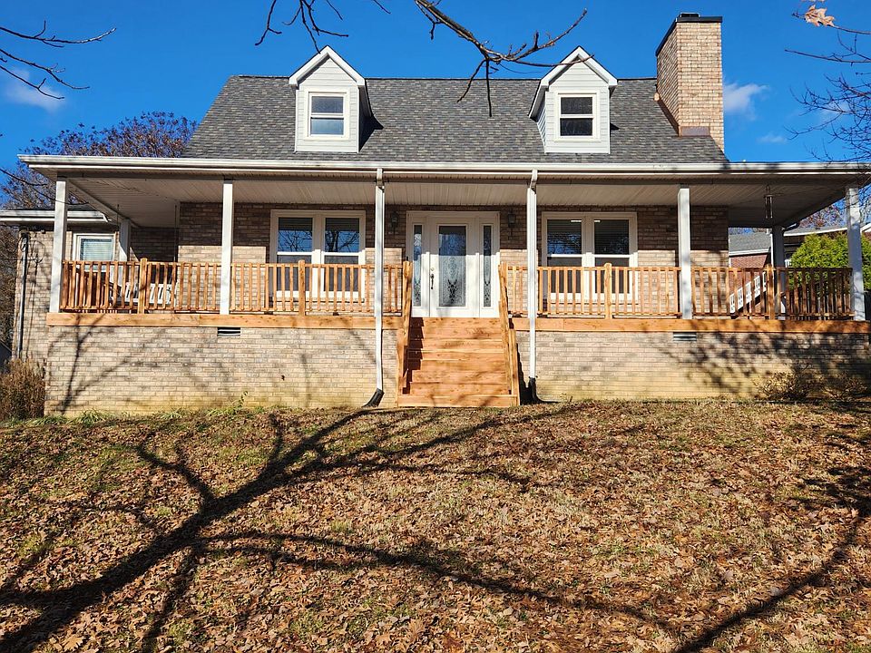 This cape cod house boast new eastern cedar steps and railings, which will soon weather to a silvery gray.