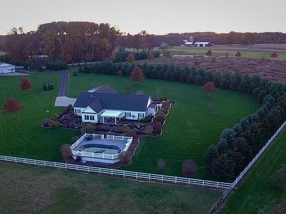 A large section of the property is hugged by pine trees for extra privacy.
