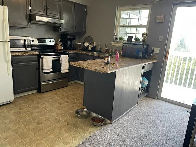 Kitchen and small deck off of kitchen.