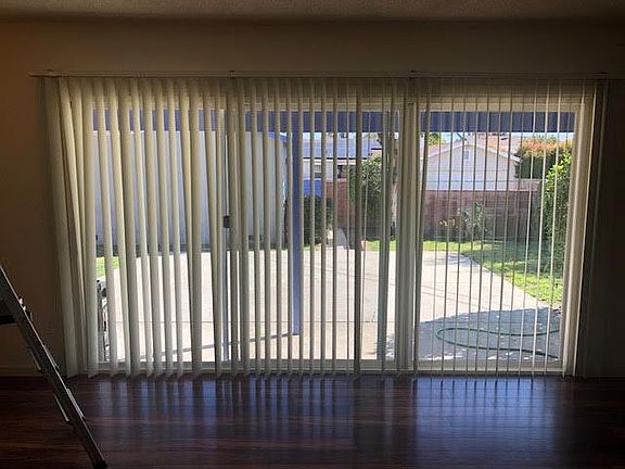 Living room and view of backyard.
