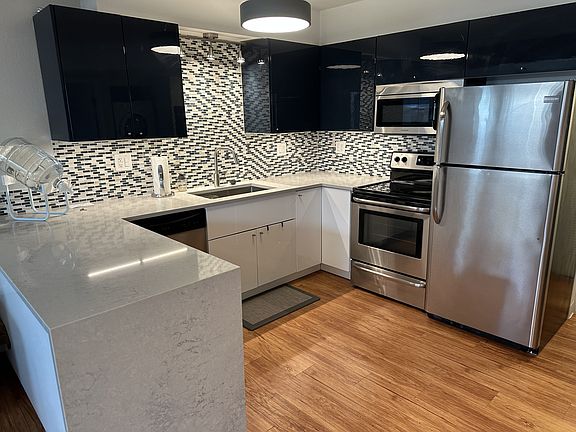 Remodeled kitchen with large sink and garbage disposal, dishwasher.