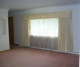 There is a large living room as well as an additional large front entry way with a coat closetbr