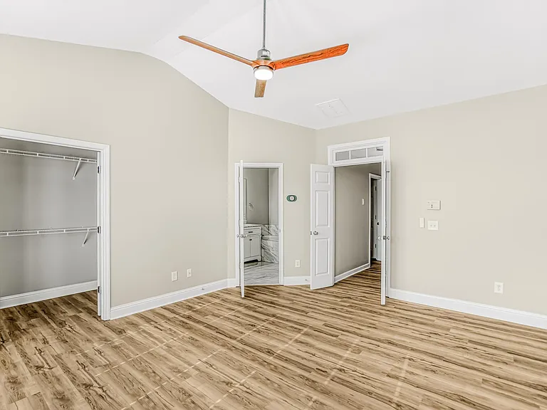 Massive main suite with walk-in closet. All hardwood flooring