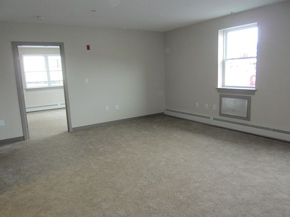 Living Room (Blinds and Curtain Rods have been installed on all windows, not shown)