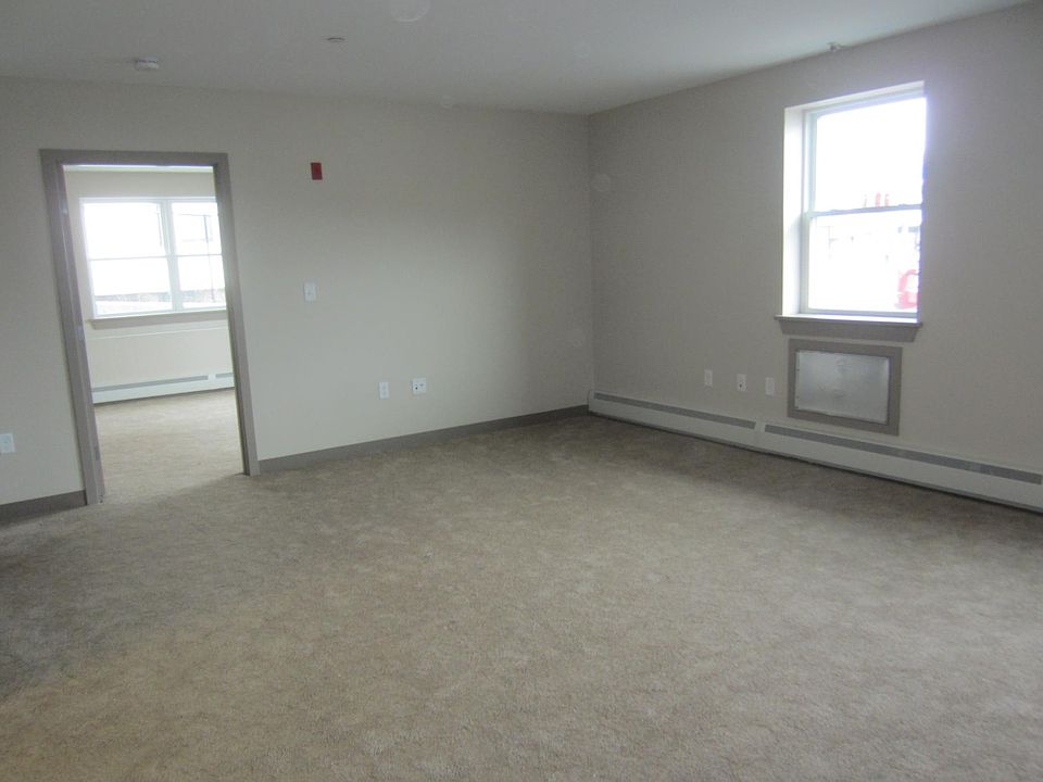 Living Room (Blinds and Curtain Rods have been installed on all windows, not shown)