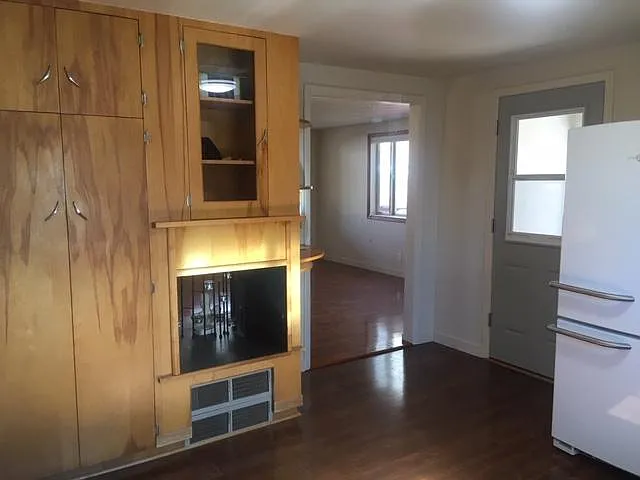 More of kitchen area with storage cabinets.