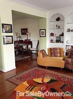 Lounge-Dining Room
						:
						Open plan lounge/dining area includes cabinetry, crown moulding, columns