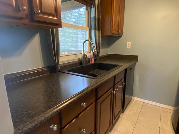 Galley Kitchen, window overlooking deck and lake view.