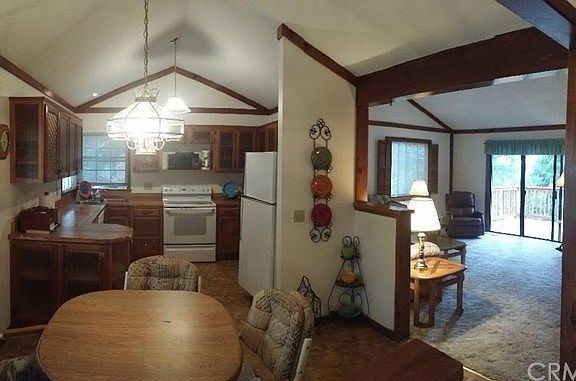 View of kitchen, dining area and living room.
