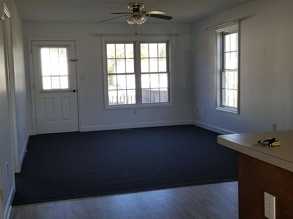 Living area opens onto back deck.