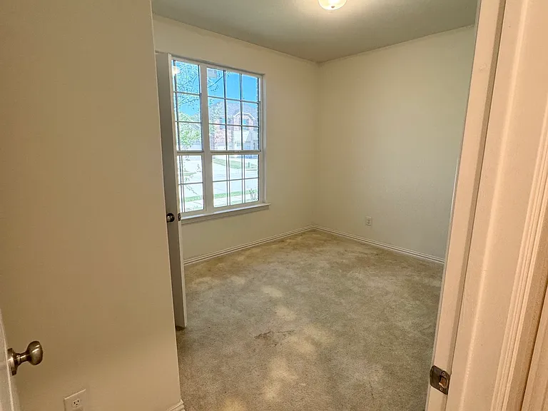 Secondary bedroom downstairs with large closet.