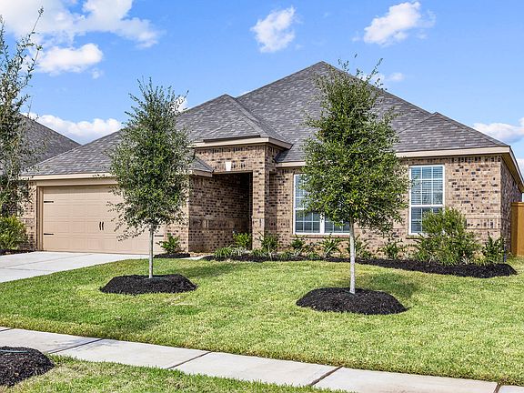 The Leland is a single story home with brick.