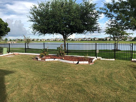 Backyard opens to the community lake