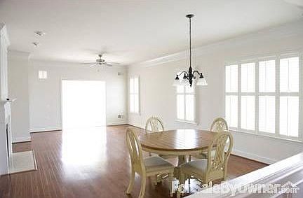 Spacious...light filled living room... : Plantation shutters & wood floors throughout