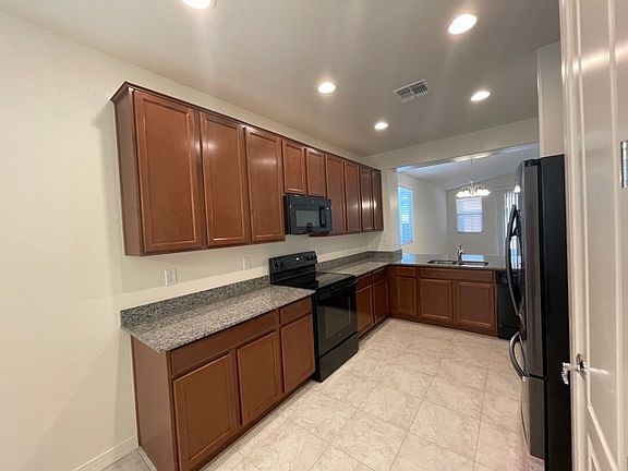 Lots of kitchen cabinets, pantry, and storage