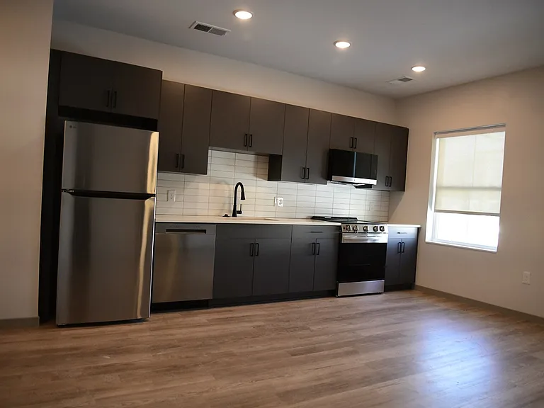 Timeless design with dark granite and charcoal cabinetry
