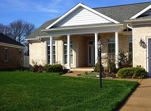 Nicely landscaped, grass sod, and sprinkler system.