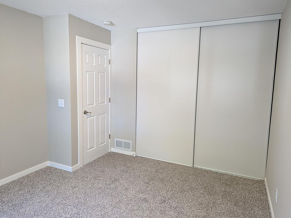 2nd bedroom closet with full height sliding doors.