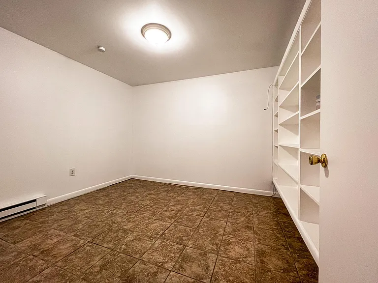 Bedroom with built in-wall book case