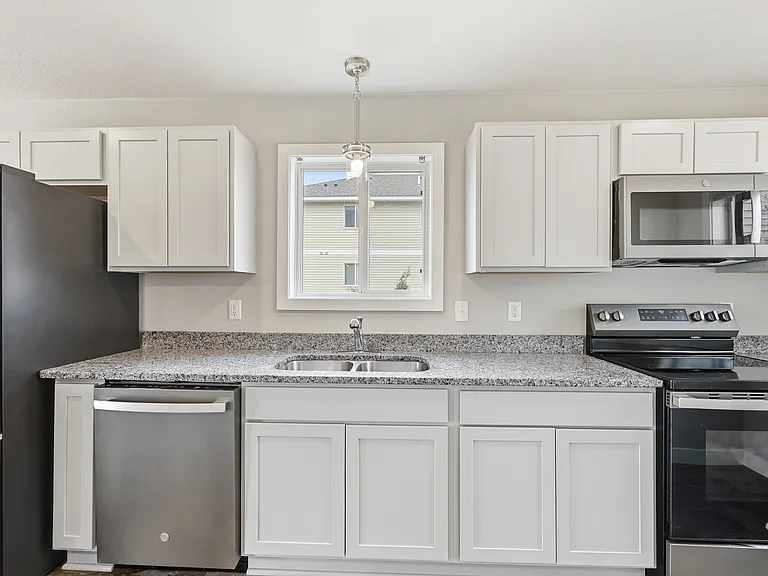 Very nice white cabinets.